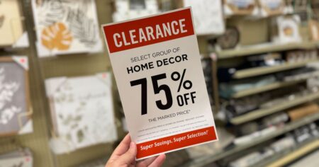 hand holding a hobby lobby clearance sign