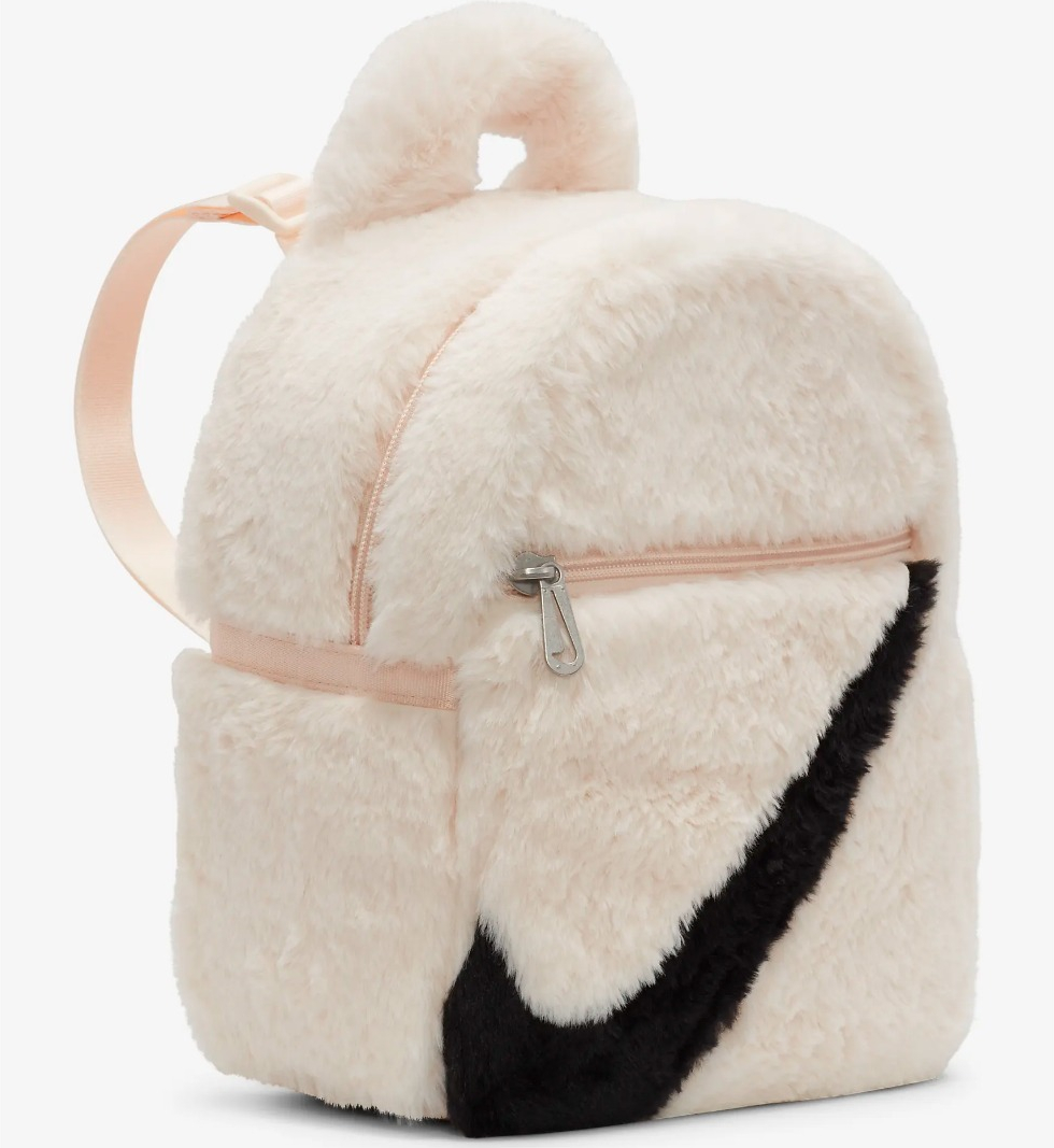 white faux fur Nike backpack with black logo