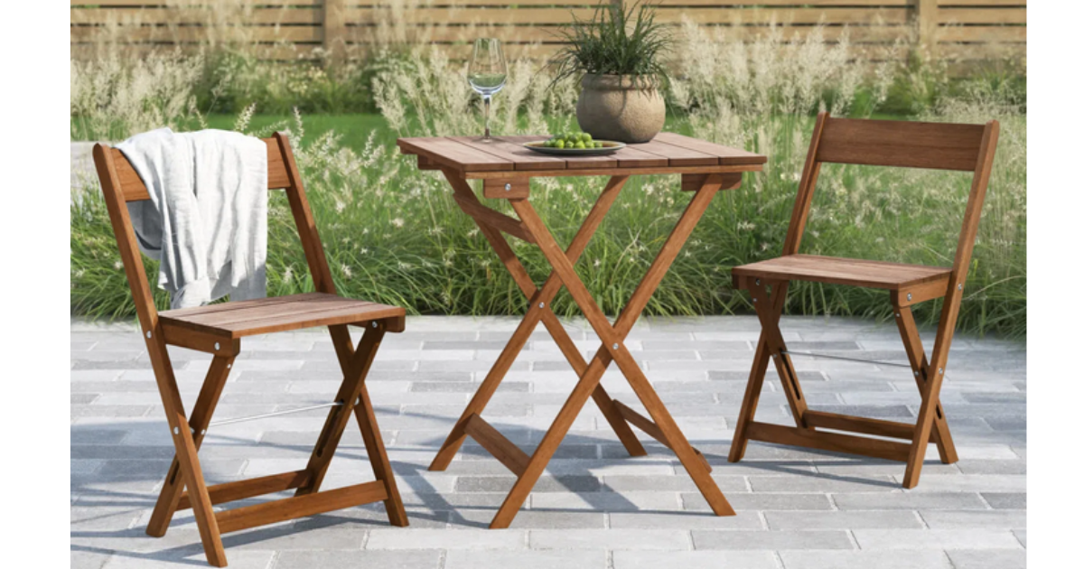 bistro set on a patio with plants
