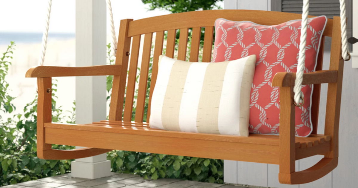 rocking chair on a porch with pillows