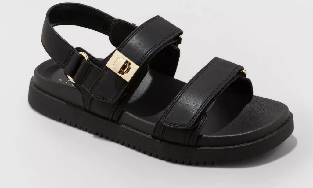 black sandal with a gold buckle
