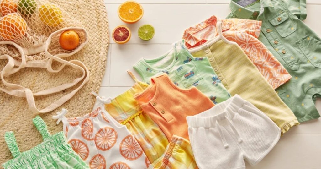 Carter's summer baby clothes laid out