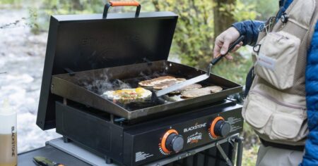 man cooking on a Blackstone griddle