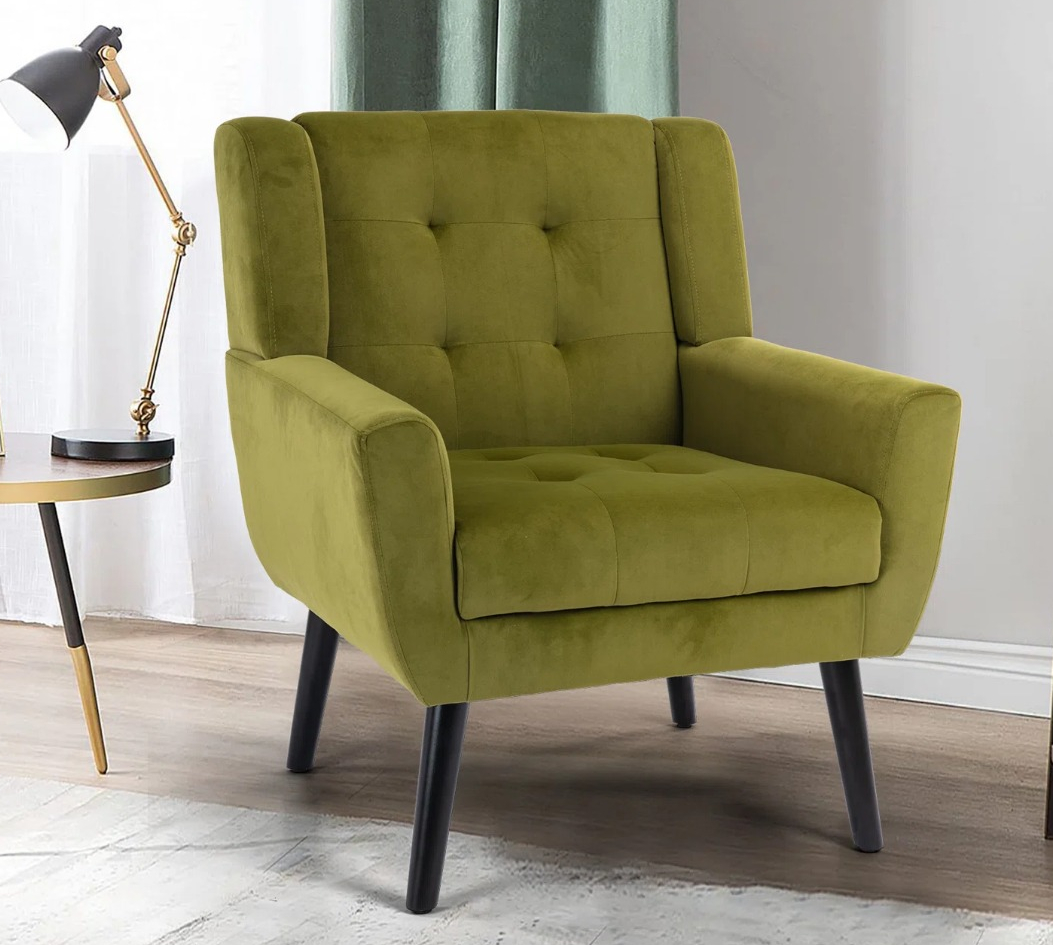 Bolanle Upholstered Armchair green chair next to a table