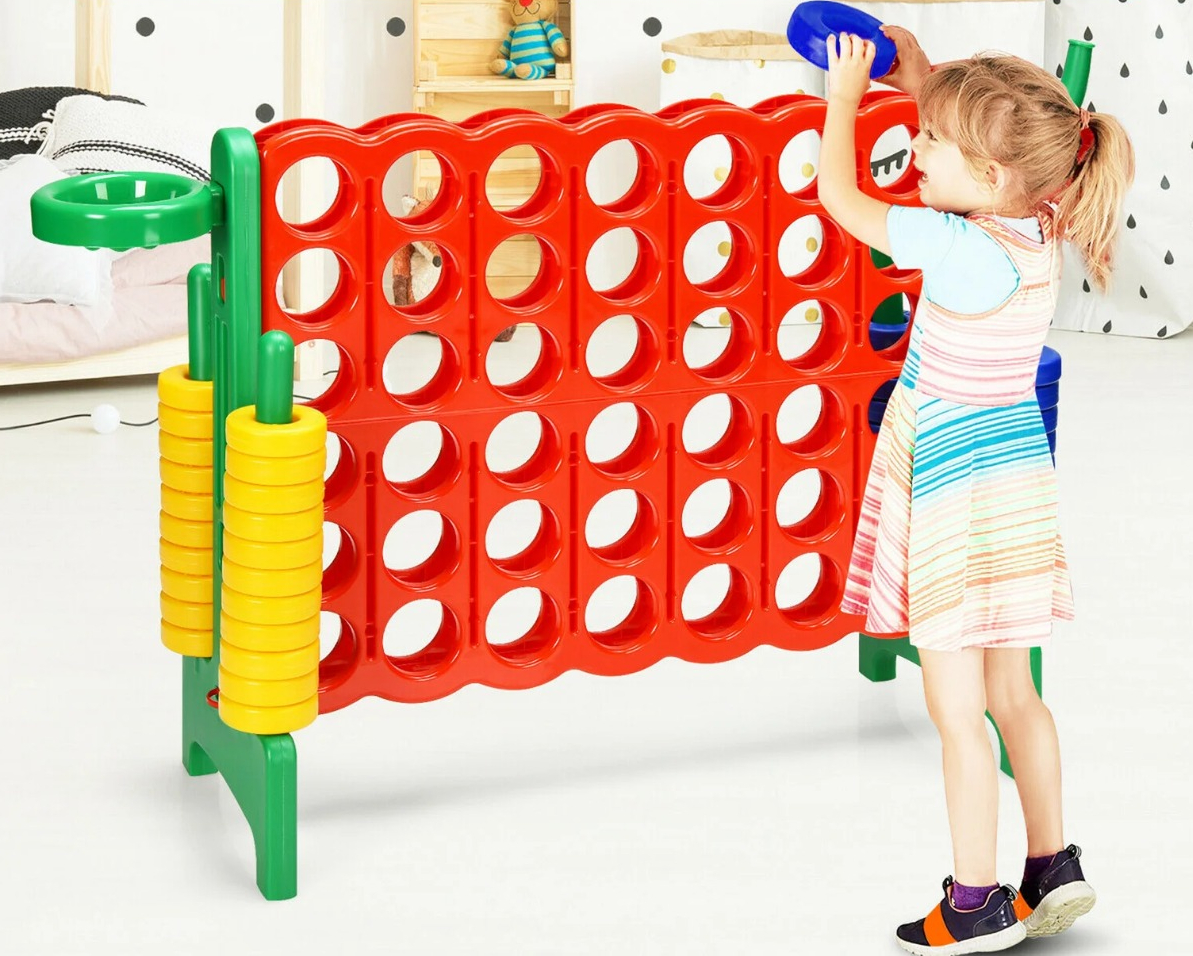 Gymax Plastic Foldable 4 to Score Giant Game Set girl playing a large four across game