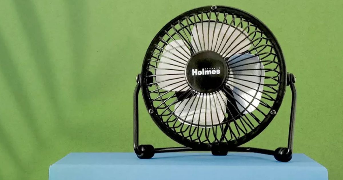 fan on a stack of books