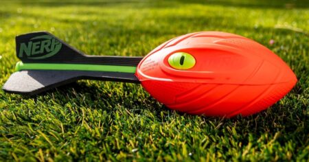 NERF football sitting in the grass