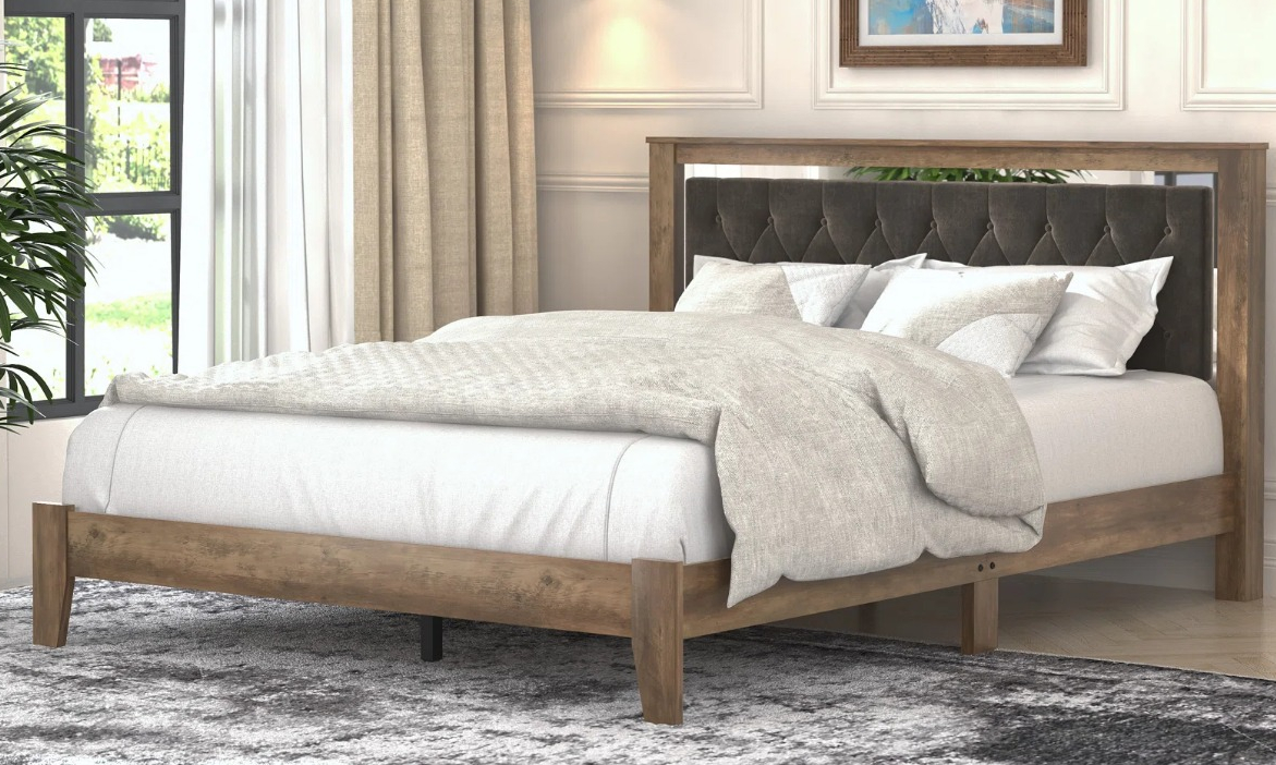 Tevrat Queen Platform Bed with Headboard bed with blankets on it