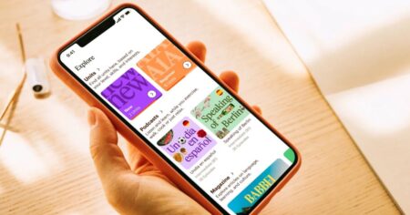 hand holding a phone with the Babbel app on it