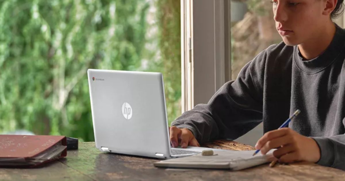 man working on a Chromebook