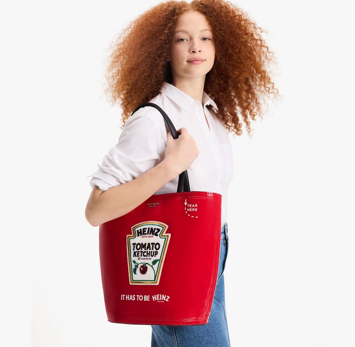 woman carrying a Heinz Kate Spade tote bag