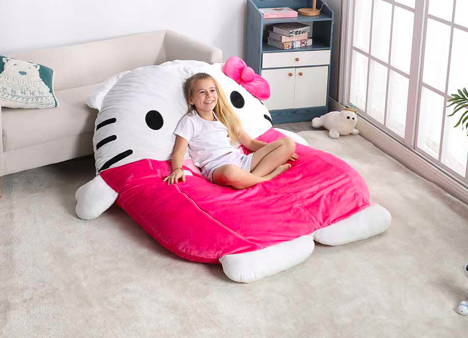 Hello Kitty Nap Mat girl sitting on a Hello Kitty nap mat