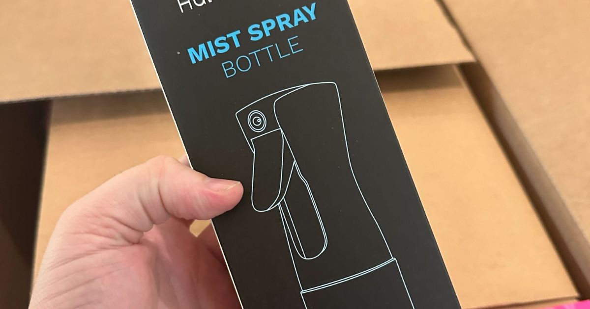 hand holding a mist bottle