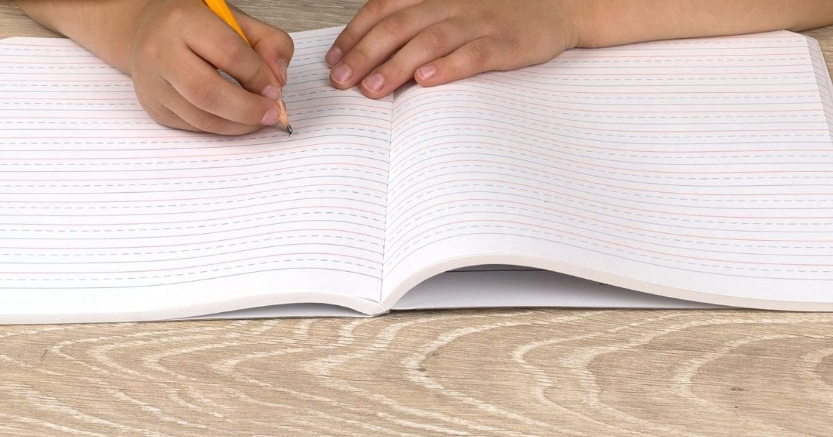 Mead Primary Notebook kid writing in a notebook