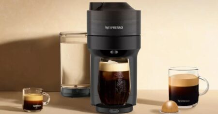 Nespresso Vertuo Pop machine with two coffee cups next to it