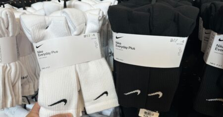 hand holding a pack of Nike socks