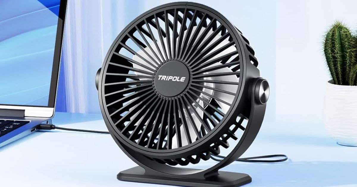 black fan on a desk