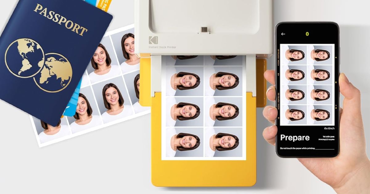 Kodak Photo Printer hand holding a phone next to a printer