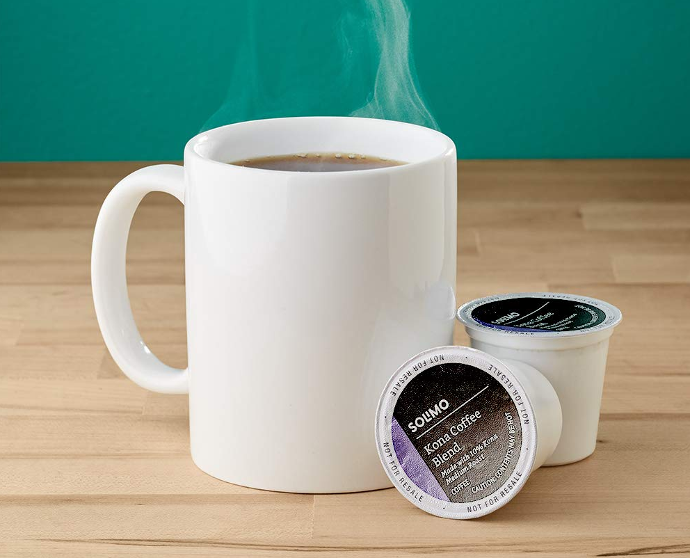 Solimo coffee pods next to a coffee mug