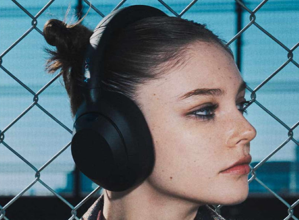 Sony ULT Wear woman wearing Sony headphones