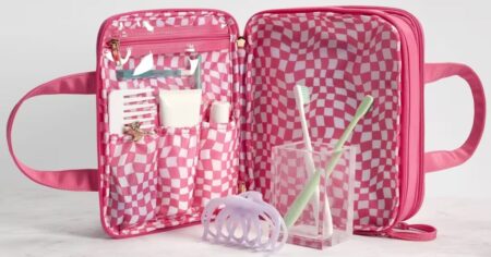 pink beauty bag with travel supplies in it