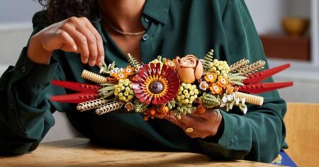 woman holding a LEGO flowers set