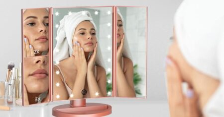 woman looking in a Lighted Makeup Mirror