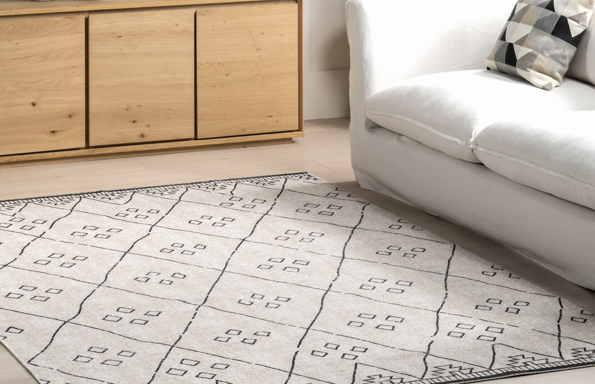 Sydney Rug rug under a couch