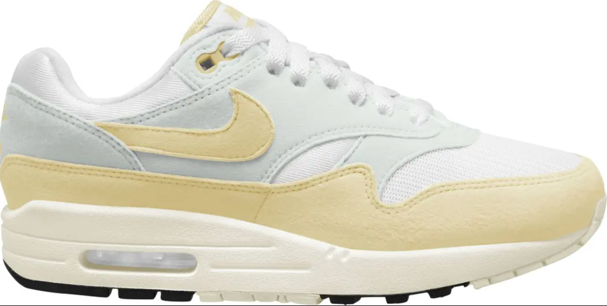 white and yellow Nike sneaker