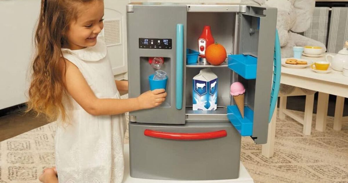Little Tikes Fridge girl playing with a Little Tikes fridge