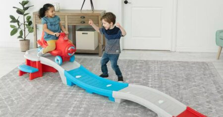 kids playing on a Step2 Sky Rider Coaster toy