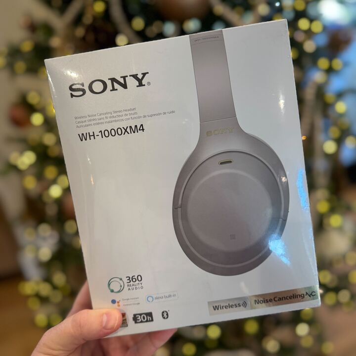 WH 1000XM4 Wireless Premium Noise Canceling Headphones box of sony headphones in front of a christmas tree