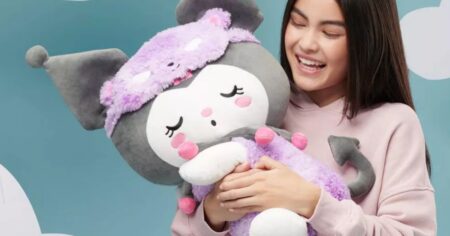 girl holding a plush toy